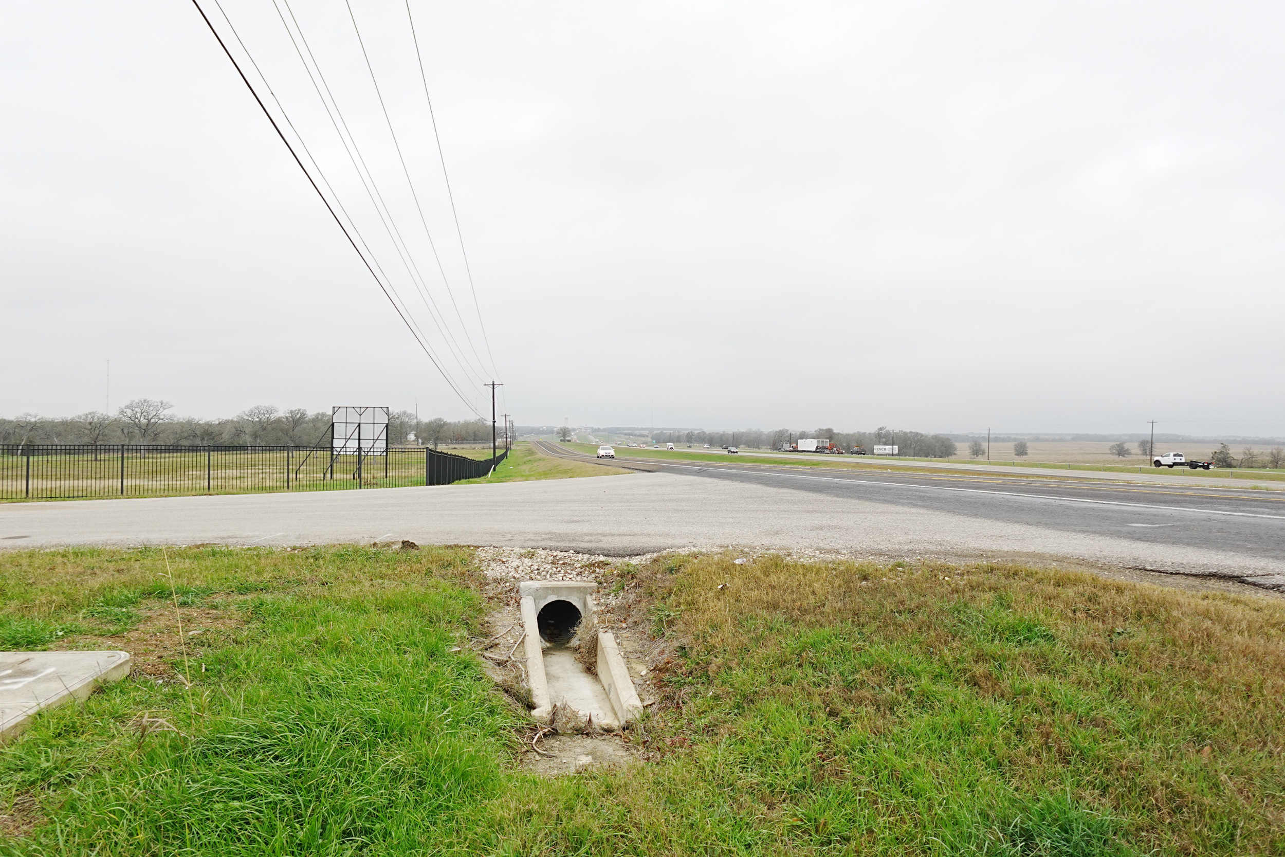 Drainage, asphalt driveway, and fencing work on a project in Bryan, TX.