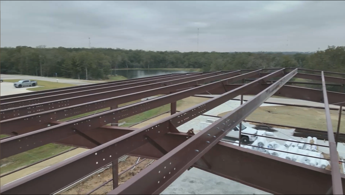 Red iron erection for a commercial building in Bryan, TX.