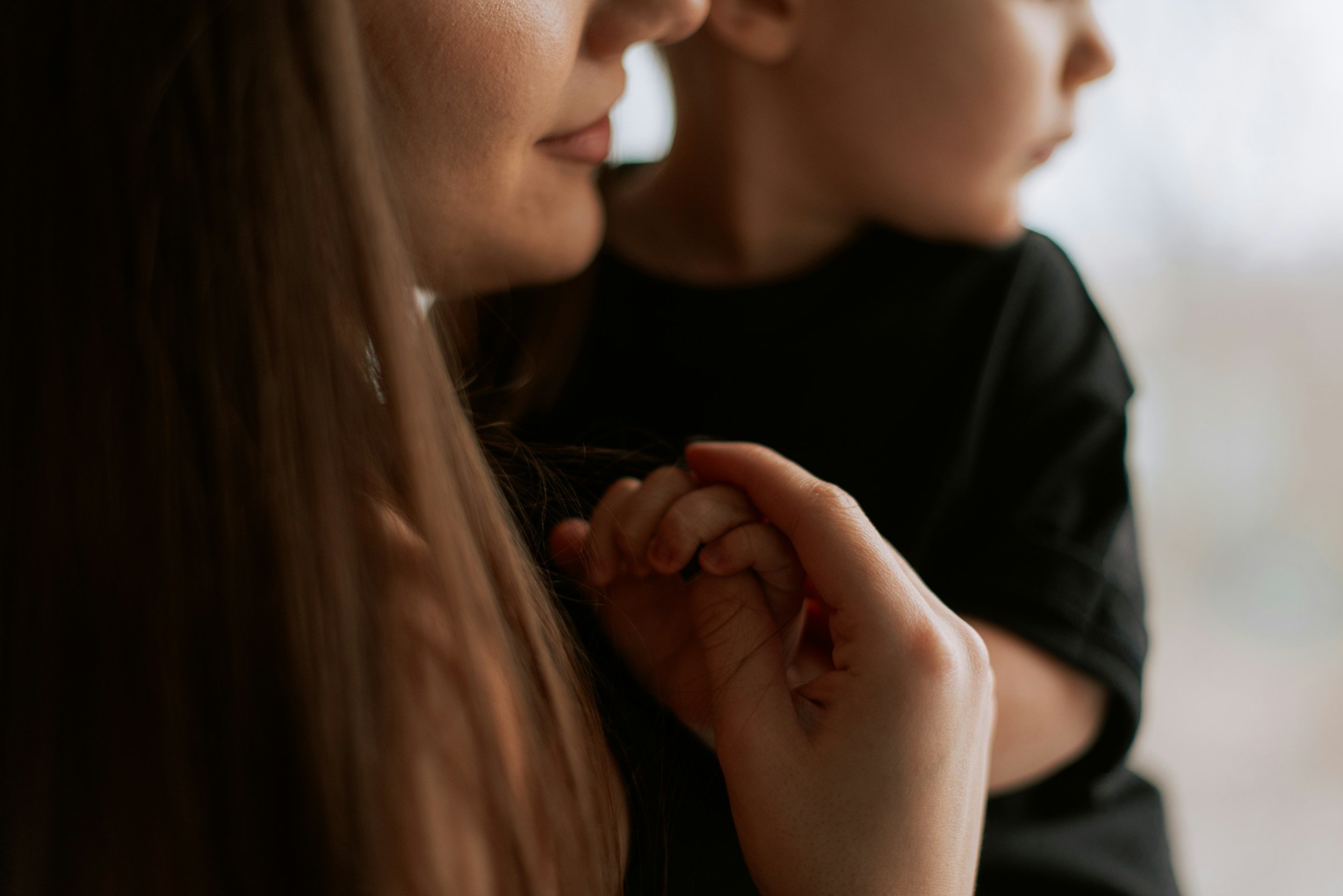 The love of a mom shown as she cares for her toddler with special needs