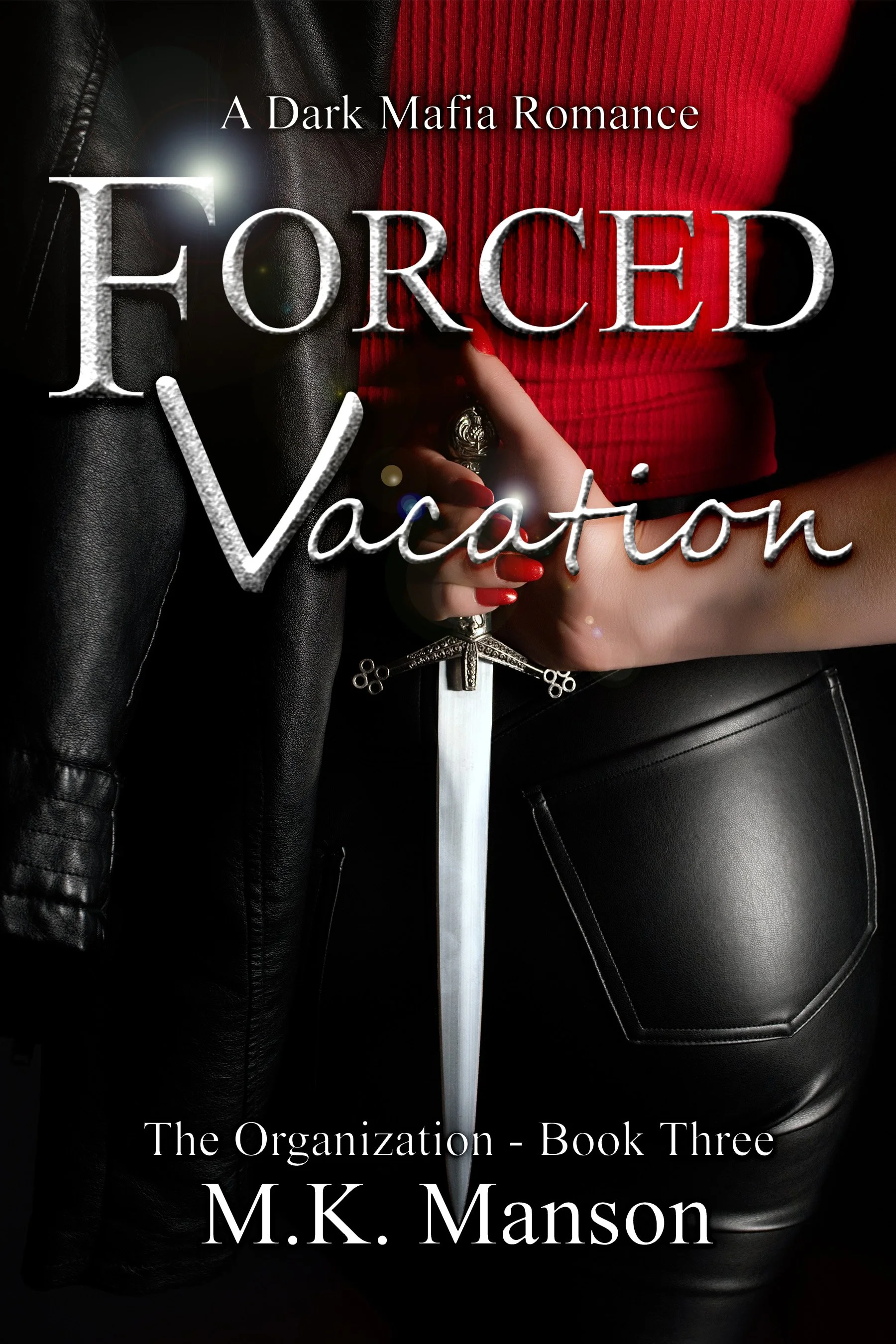 Book cover titled 'Forced Vacation' with a woman holding a sword, wearing a red top and black leather pants, with the subtitle 'The Organization - Book Three' and author M.K. Manson.