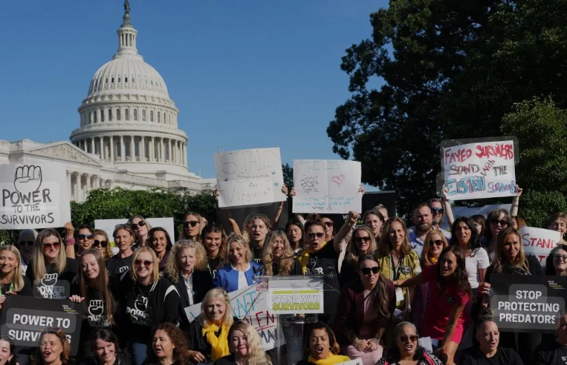 A large group of protesters, mostly women, holding signs in front of the United States Capitol building. The signs include messages like 'Power to the Survivors,' 'Stop Protecting Predators,' and 'Famed Survivors Stand With the Eisten Survivors.' The