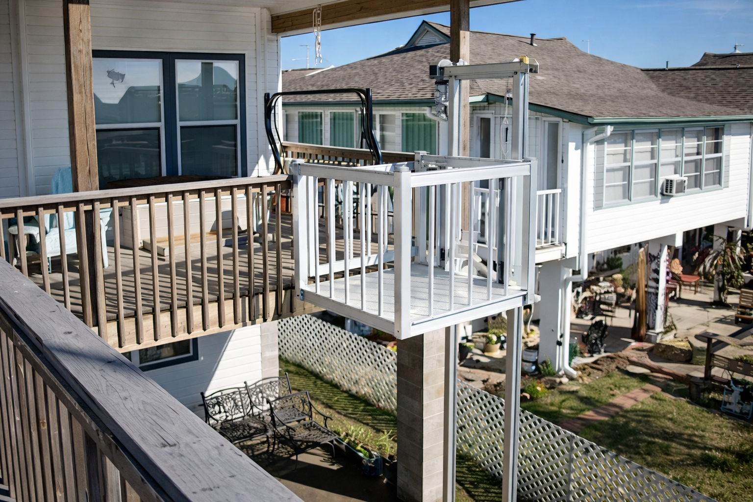 Classic Series cargo lift for elevated deck access on residential home.