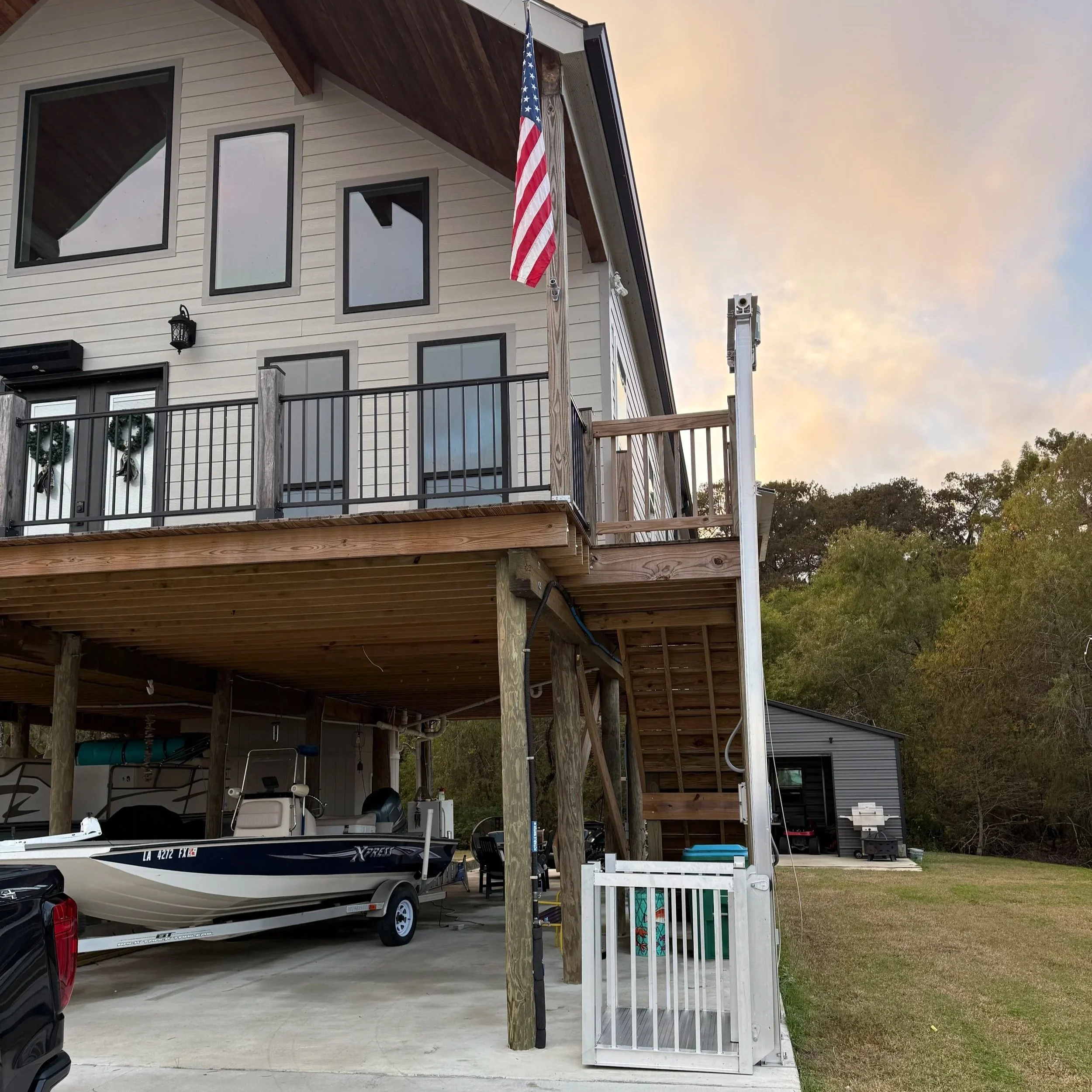 Custom residential cargo lift for elevated home deck access.