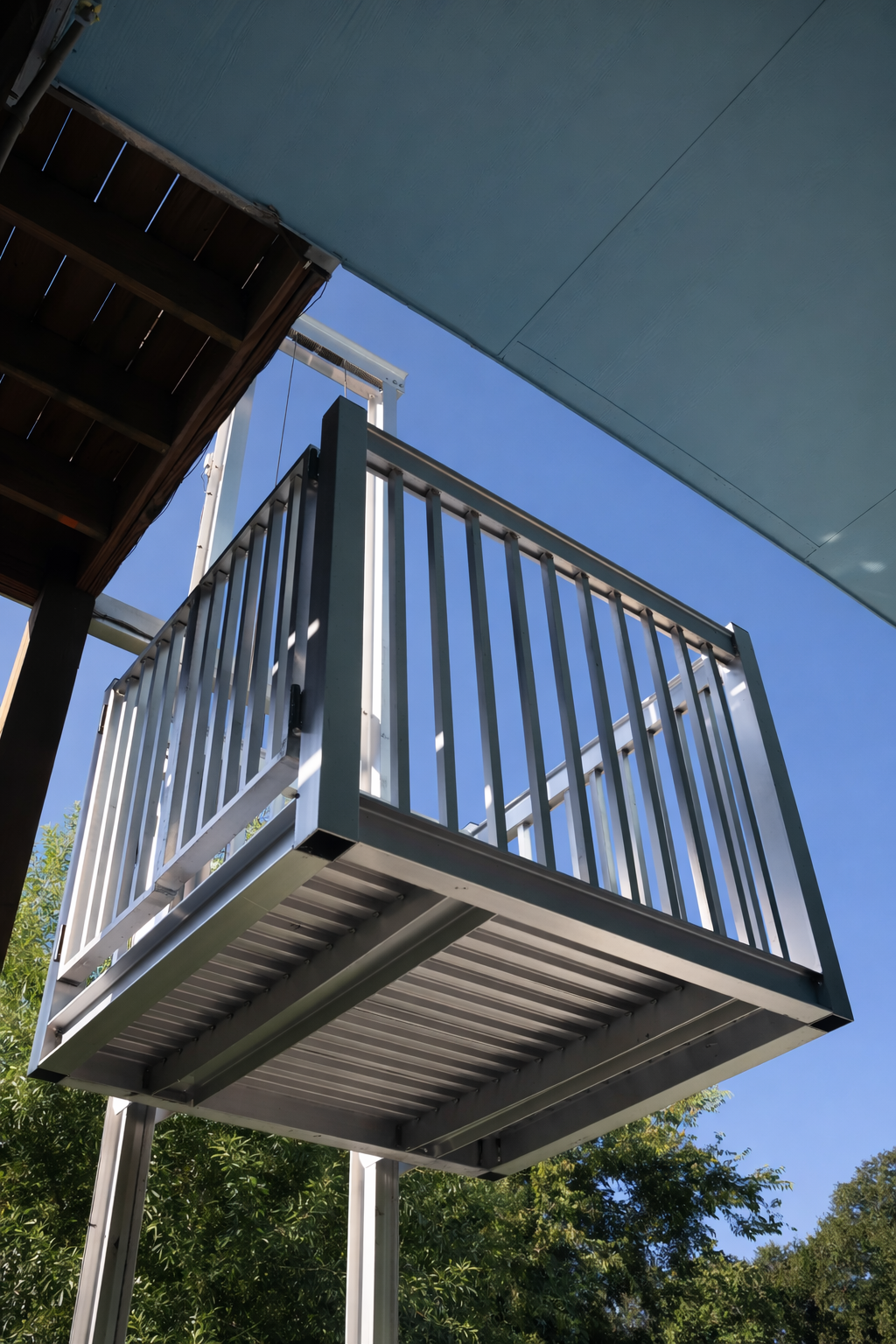 Pro Series residential cargo lift installed on elevated home deck.