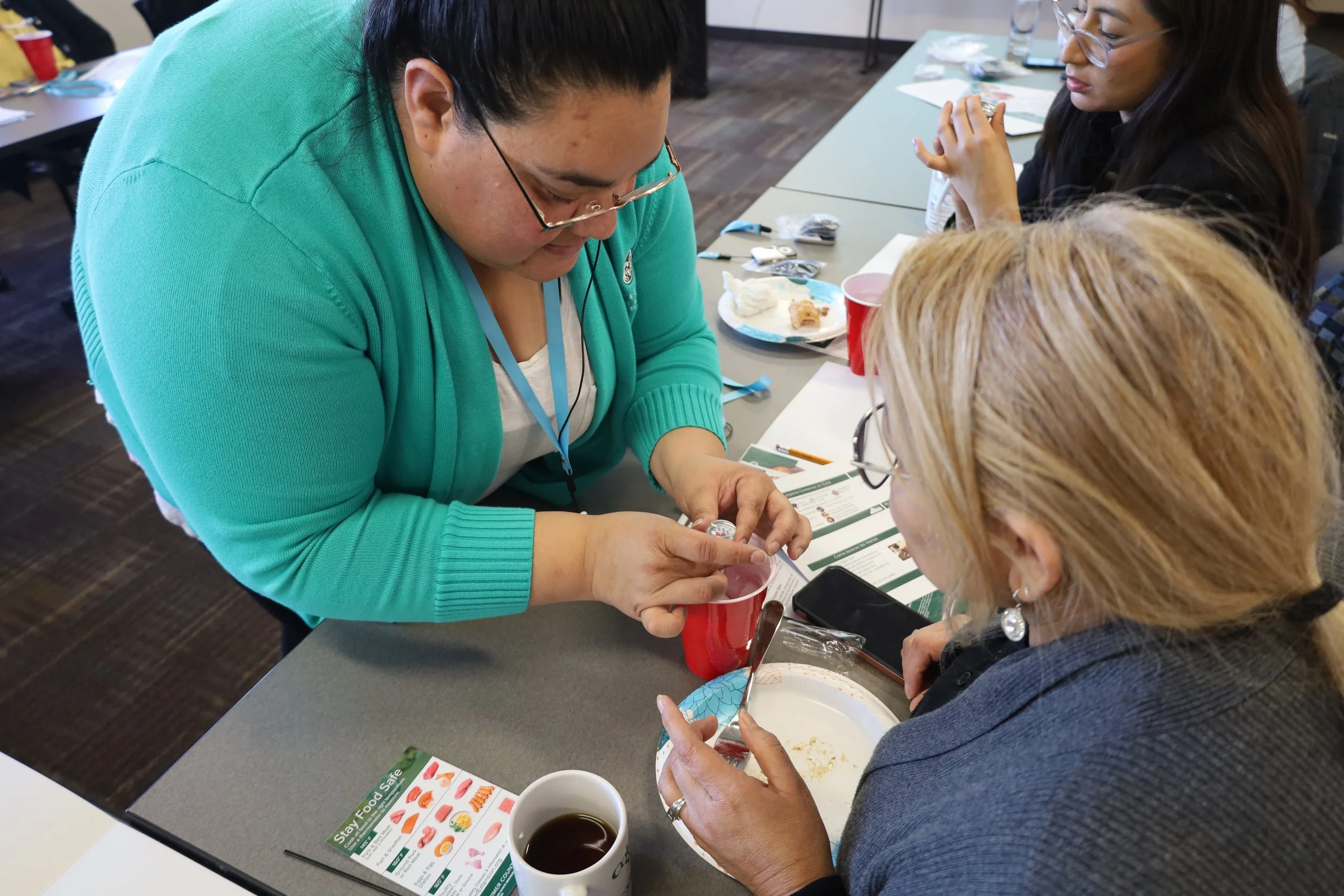 Instructor assists class with testing thermometers