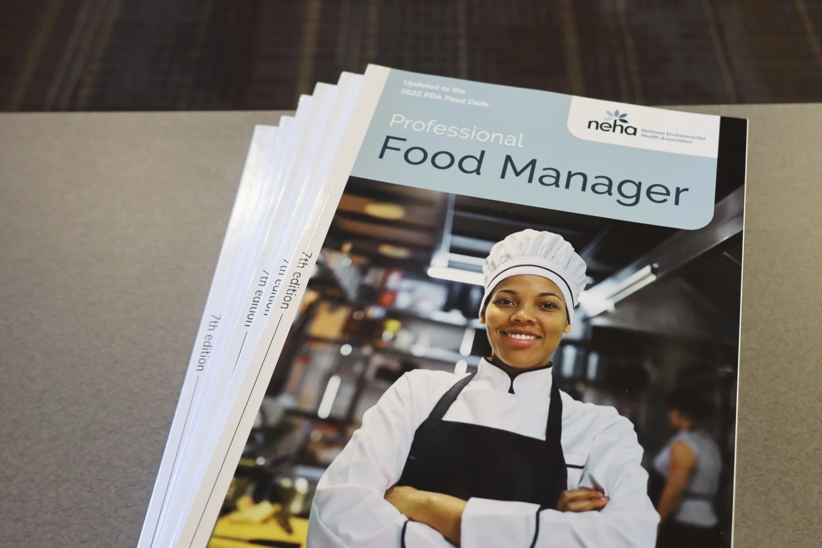 Stack of NEHA Food Safety Books
