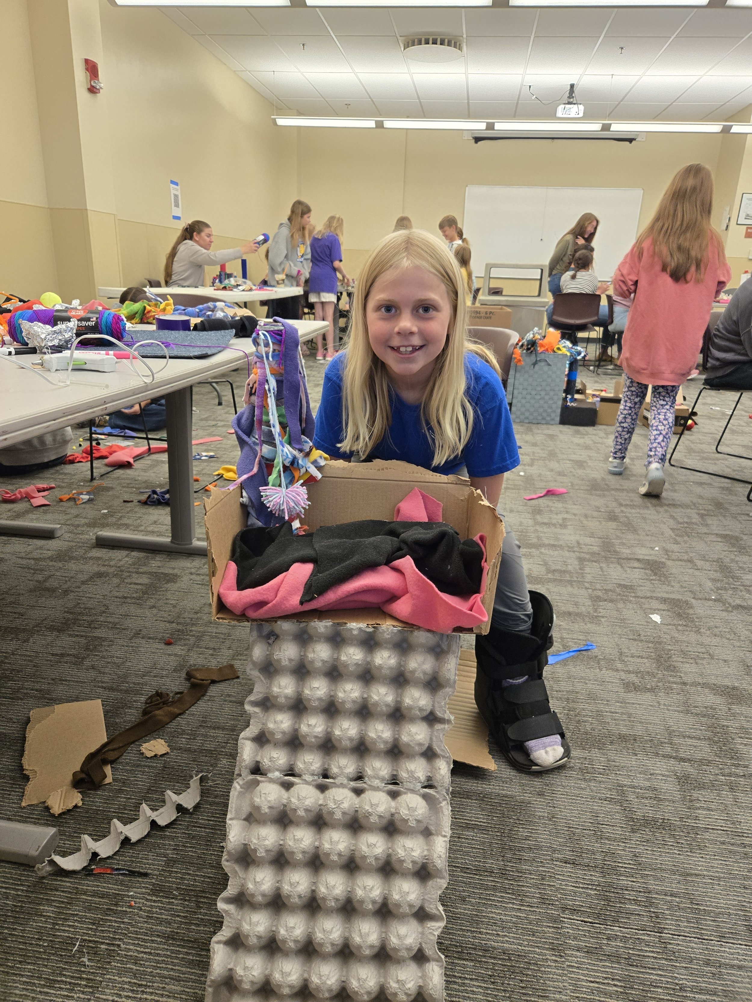 4-Her showcasing their handmade enrichment toy for NoCO Humane