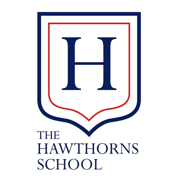 The Hawthorns School logo with blue letter H inside shield border.