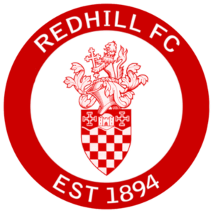 Redhill F.C. logo featuring a red and white crest with a lion on top and the year 1894 at the bottom.