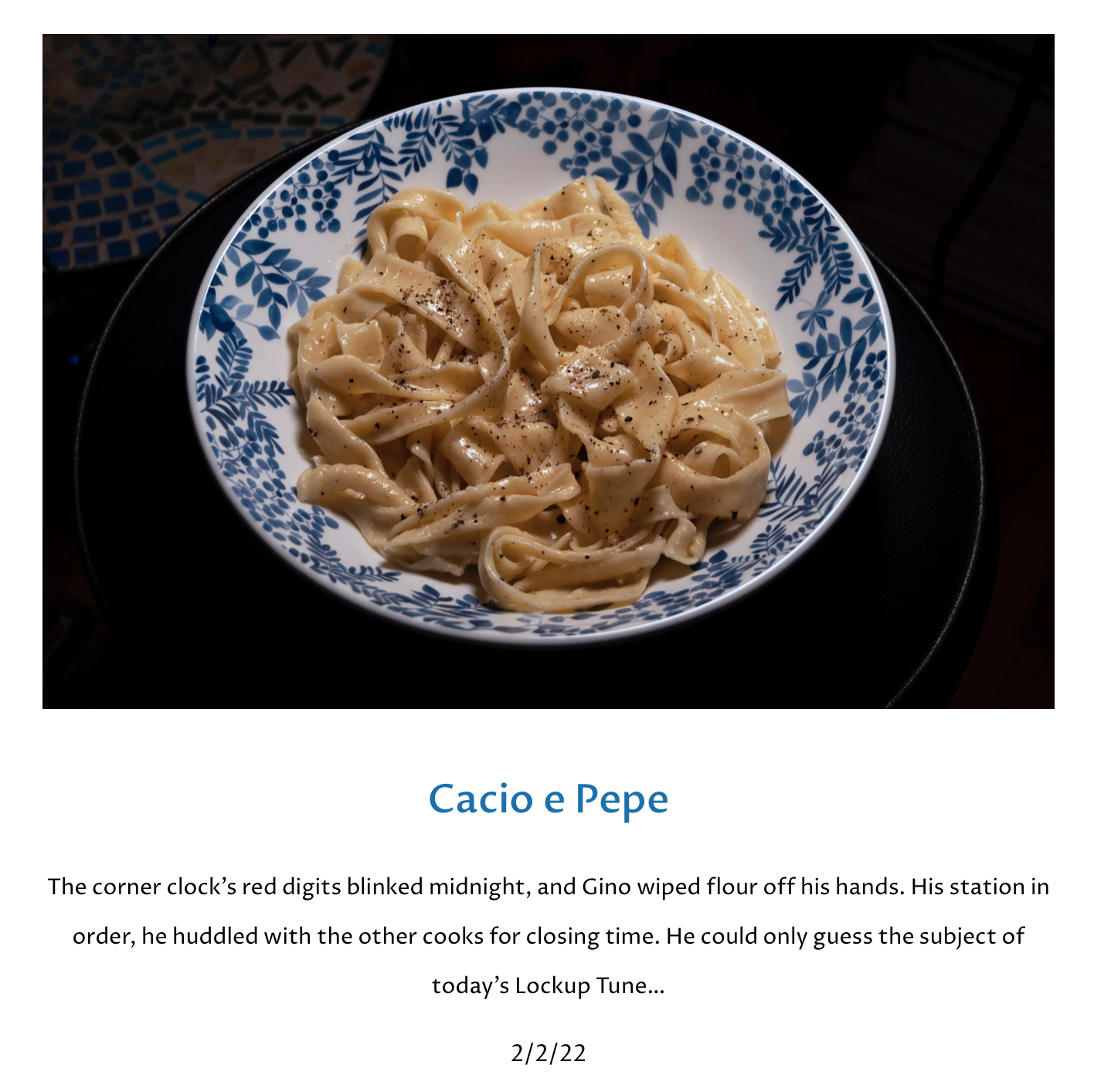 Cacio e pepe sits deliciously in a Delft blue bowl
