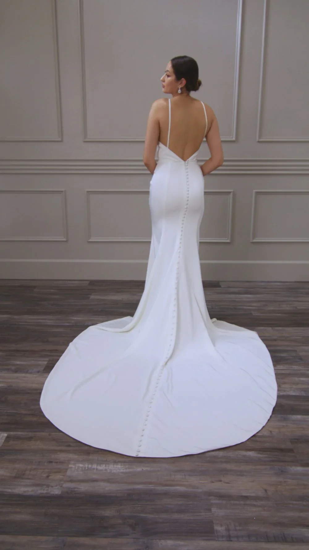 Elizabeth Lee Rebekah classic crepe fit-and-flare wedding dress with spaghetti straps and plunging neckline.