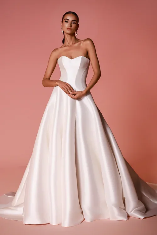Dany Tabet Montara satin ball gown wedding dress with sweetheart neckline and detachable illusion lace jacket at Bride To Be Couture Sacramento Front No Overlay.webp