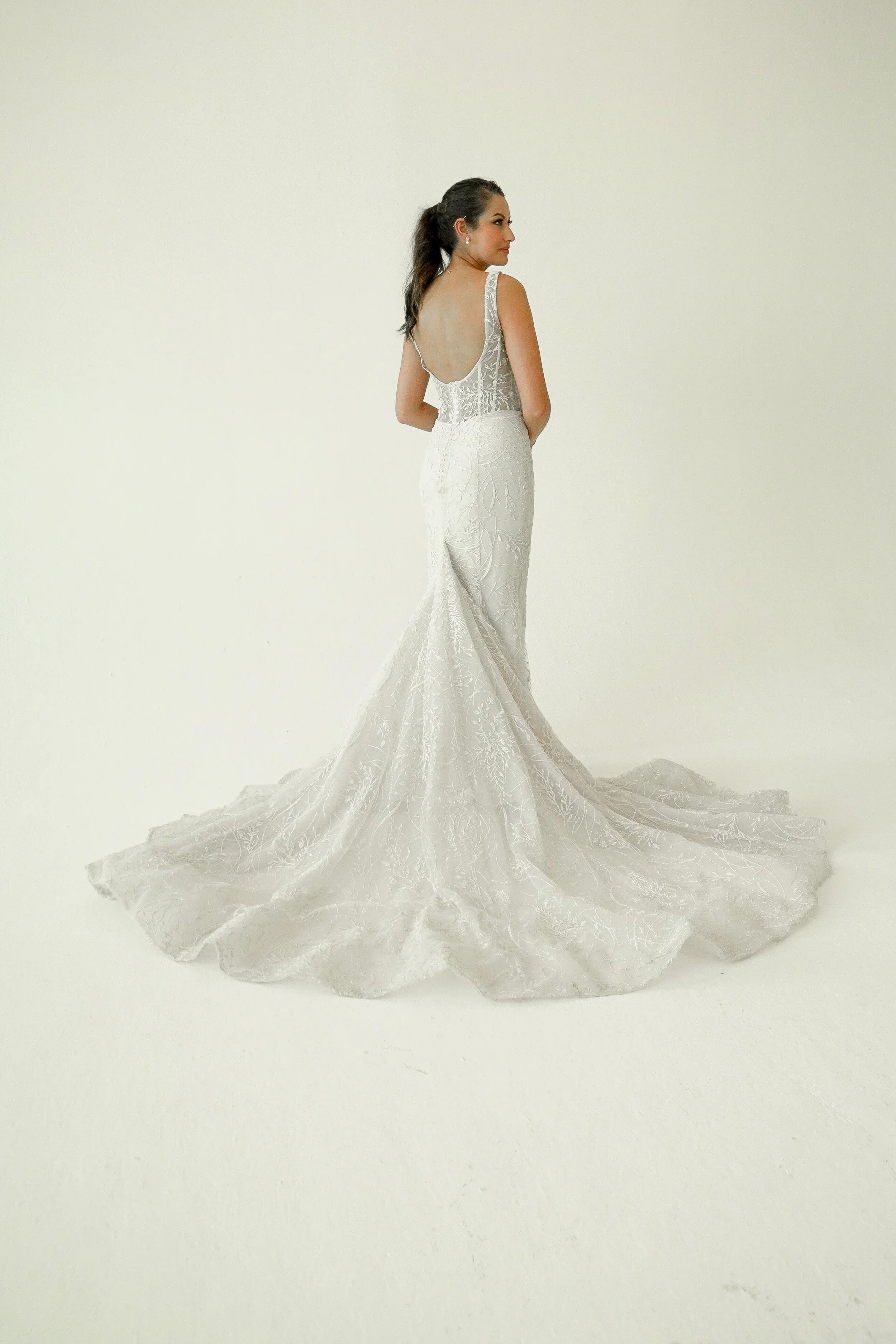 Elizabeth Lee Valentina romantic beaded lace mermaid wedding dress with tank straps, low scoop back, and long lace train.