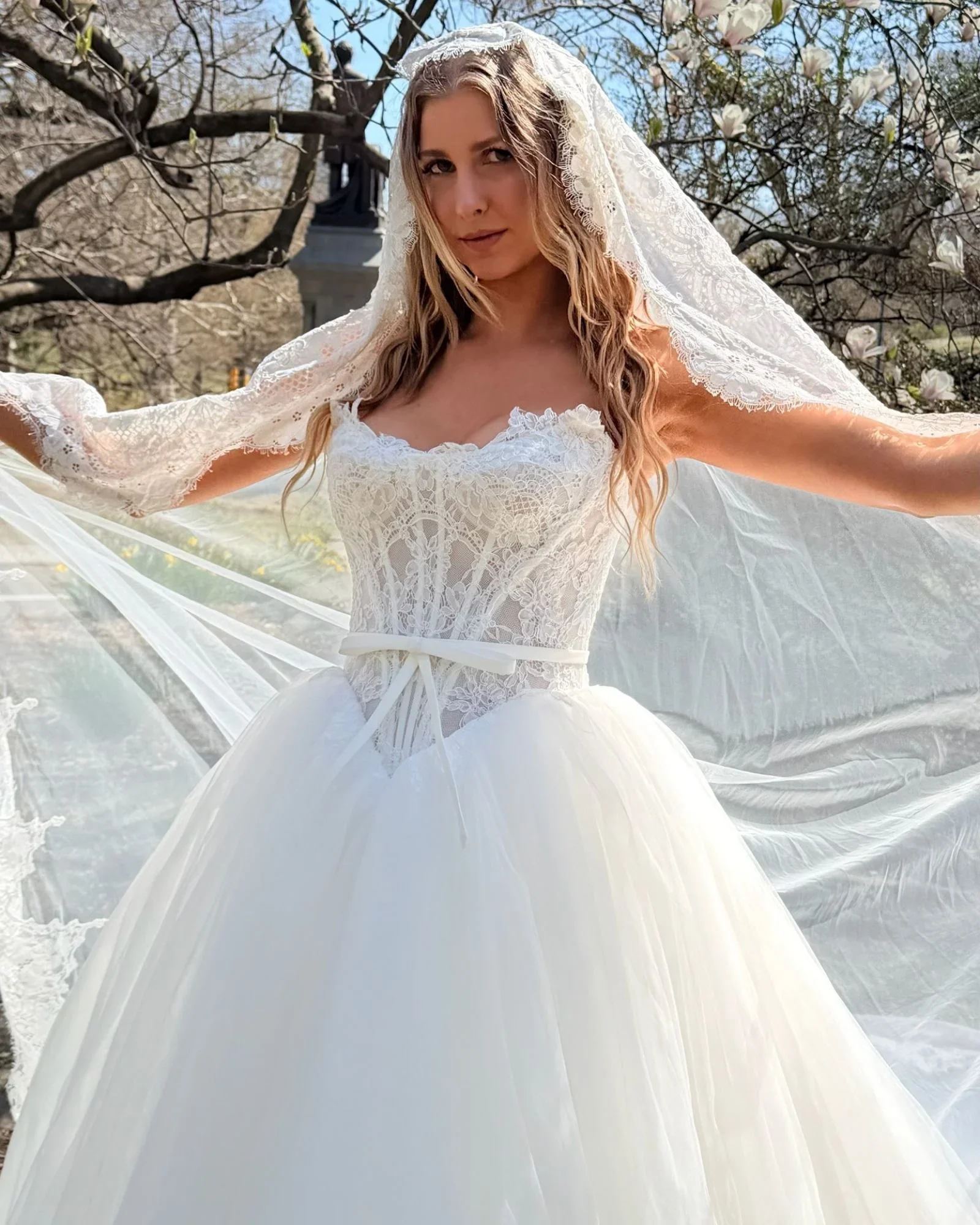 Ivory Alencon lace and tulle ballgown, scalloped strapless neckline with bias trim corset detail, basque waistline