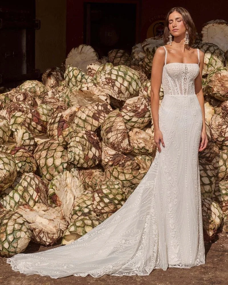 La Perle Allie boho fitted lace sheath wedding dress with semi-sweetheart square neckline, spaghetti straps, and daring backless design.