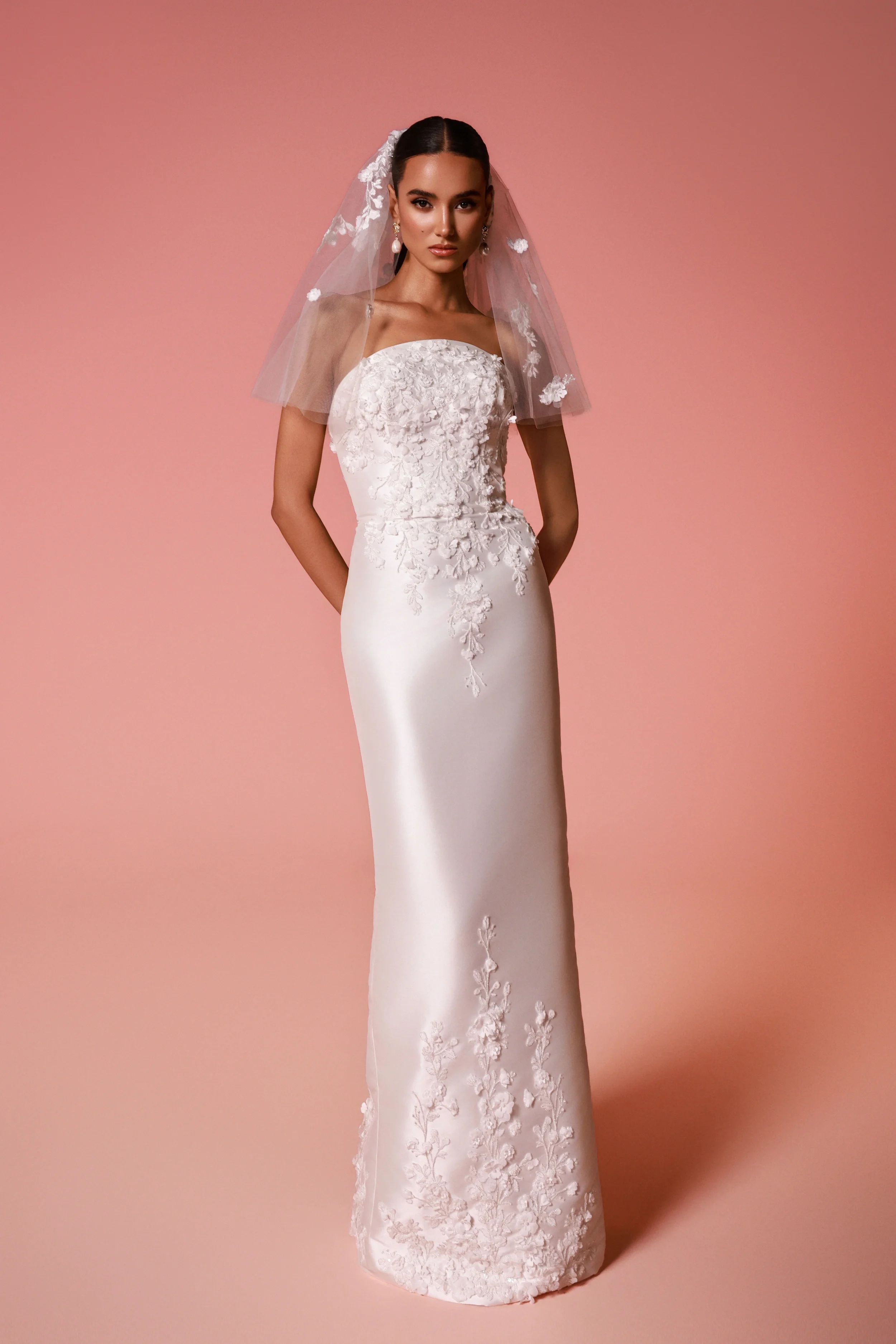 Dany Tabet Rivara strapless satin mermaid wedding dress with 3D floral appliqués and detachable overskirt at Bride To Be Couture Sacramento Front Dress Only.webp