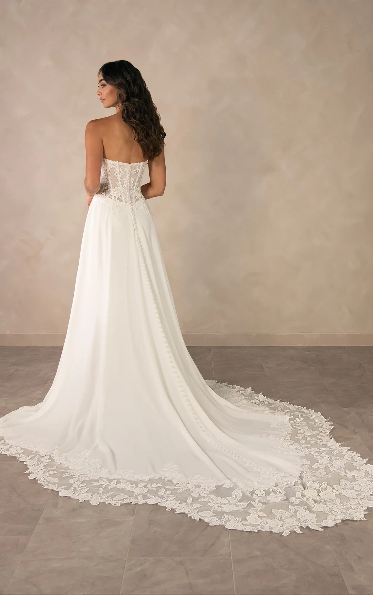 Essense of Australia D4504 minimalist strapless sweetheart A-line wedding gown in liquid crepe with lace appliqués, pleated skirt, sheer lace back, and scalloped lace train Back.webp