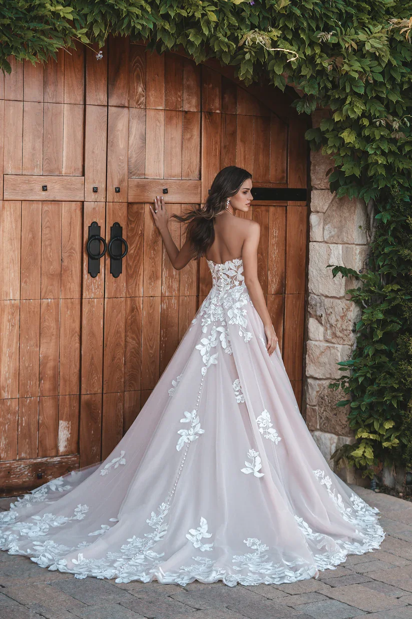 Allure Bridals A1208 strapless ballgown wedding dress with overblown leaf and bloom matte lace appliques over a traditional full tulle skirt.