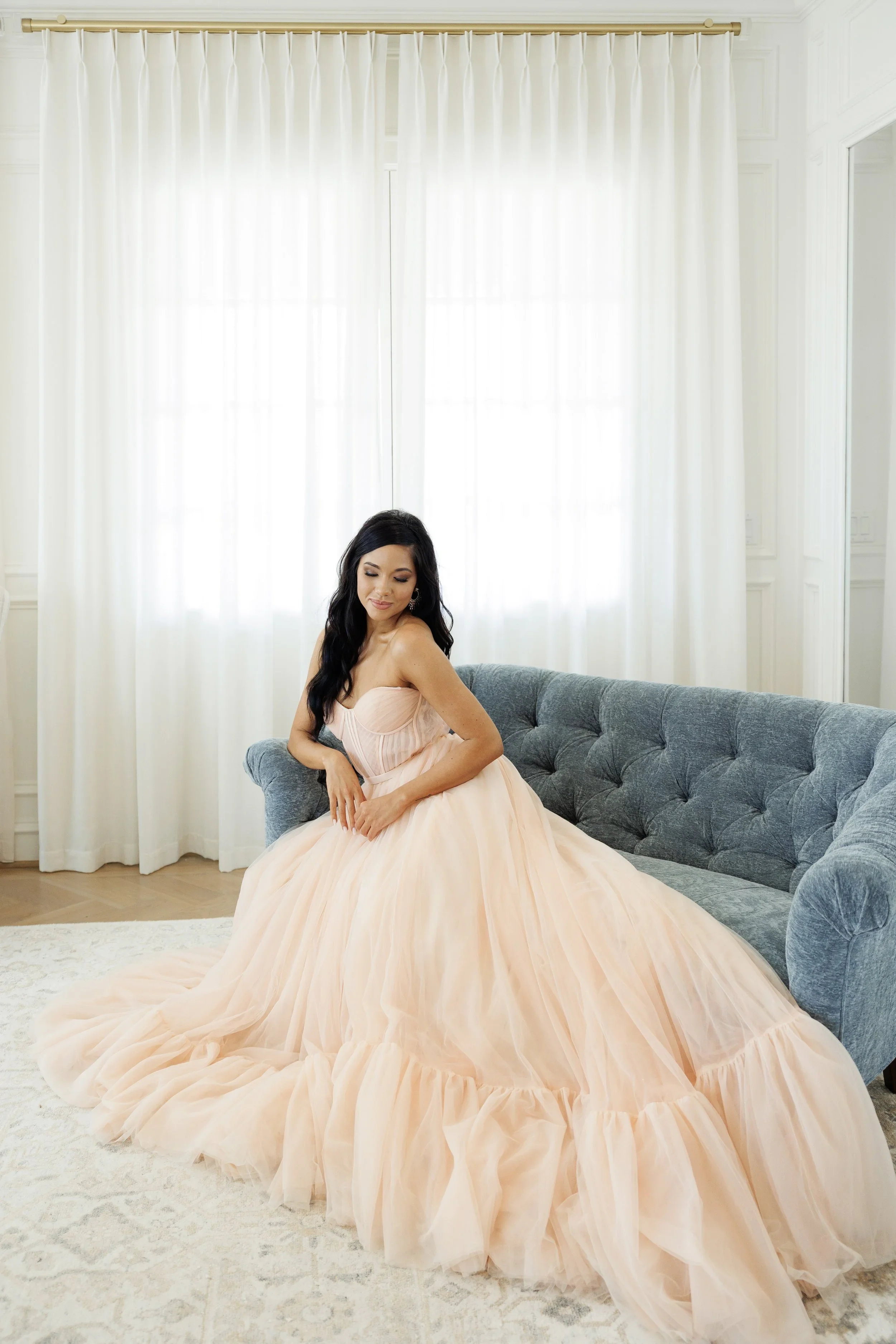 Elizabeth Lee Cleo layered tulle wedding dress with see-through boning bodice and ethereal flowing skirt.