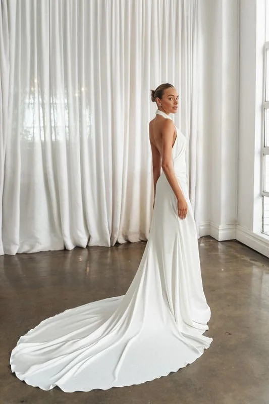 La Premiere Epic crepe mermaid wedding gown with halter neckline and three-dimensional figure-enhancing silhouette.