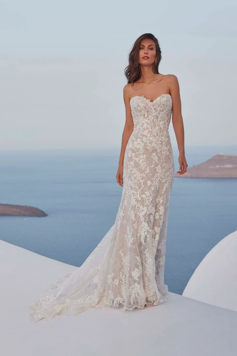 Madison James Francesca beaded and sequined Chantilly lace strapless sheath wedding gown.