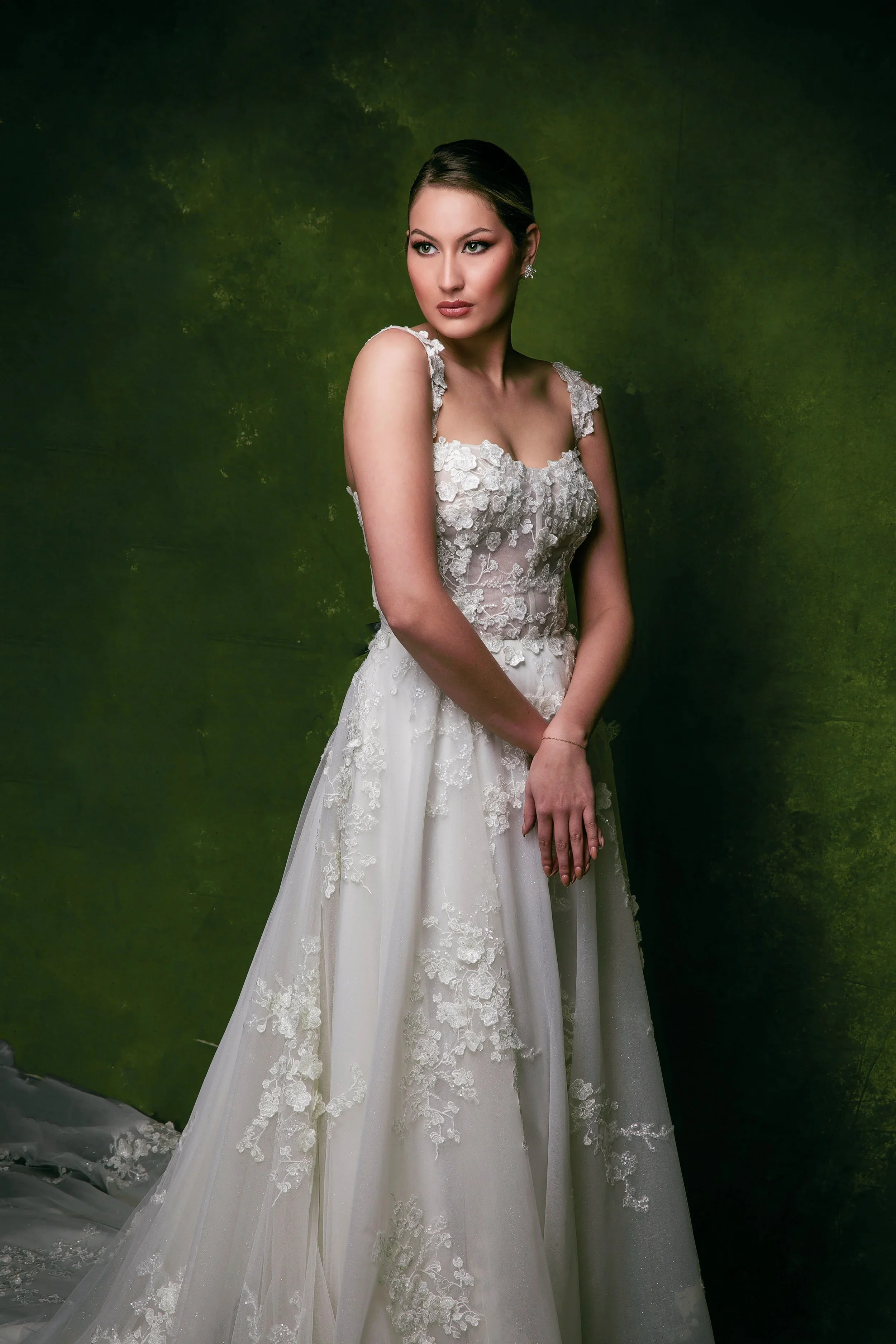 Elizabeth Lee Genesis A-line wedding dress with 3D floral lace details, thin straps, and slightly curved straight neckline.