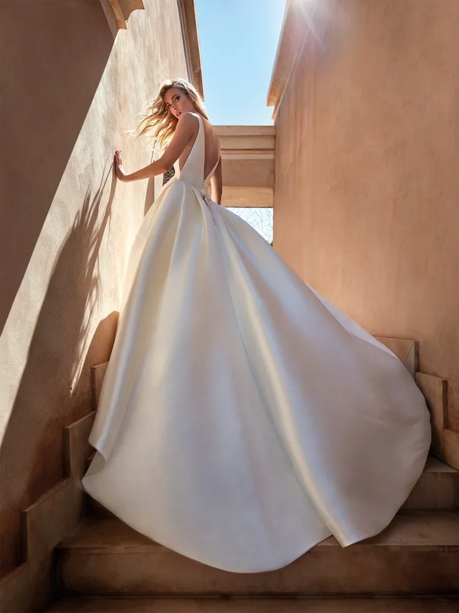 Pronovias Nevado A-line Mikado wedding dress with a clean boat neckline and refined structured silhouette.