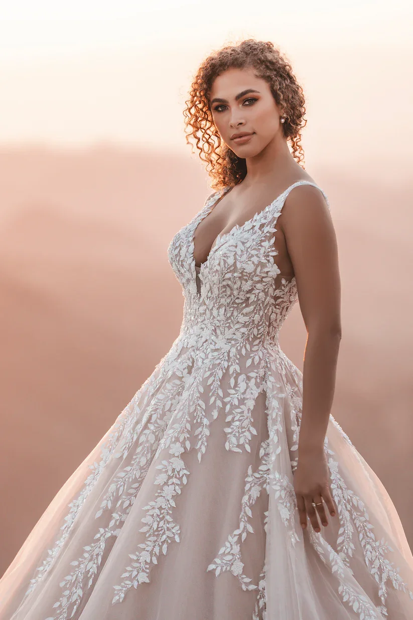 Allure Bridals A1203 sleeveless V-neck ballgown wedding dress with leaf-shaped beaded and sequined lace appliques trailing down the bodice and full tulle skirt.
