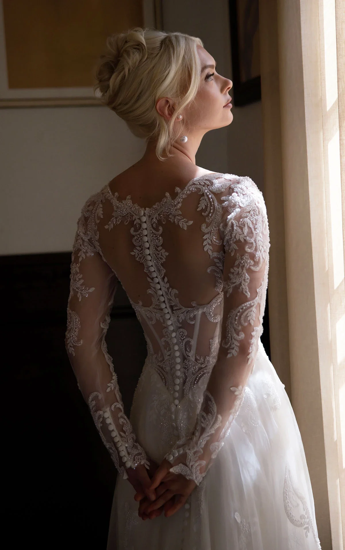 Essense of Australia D4577 romantic A-line wedding gown with sweetheart neckline, detachable floral lace long sleeves, basque waist, and illusion lace back with sweeping train