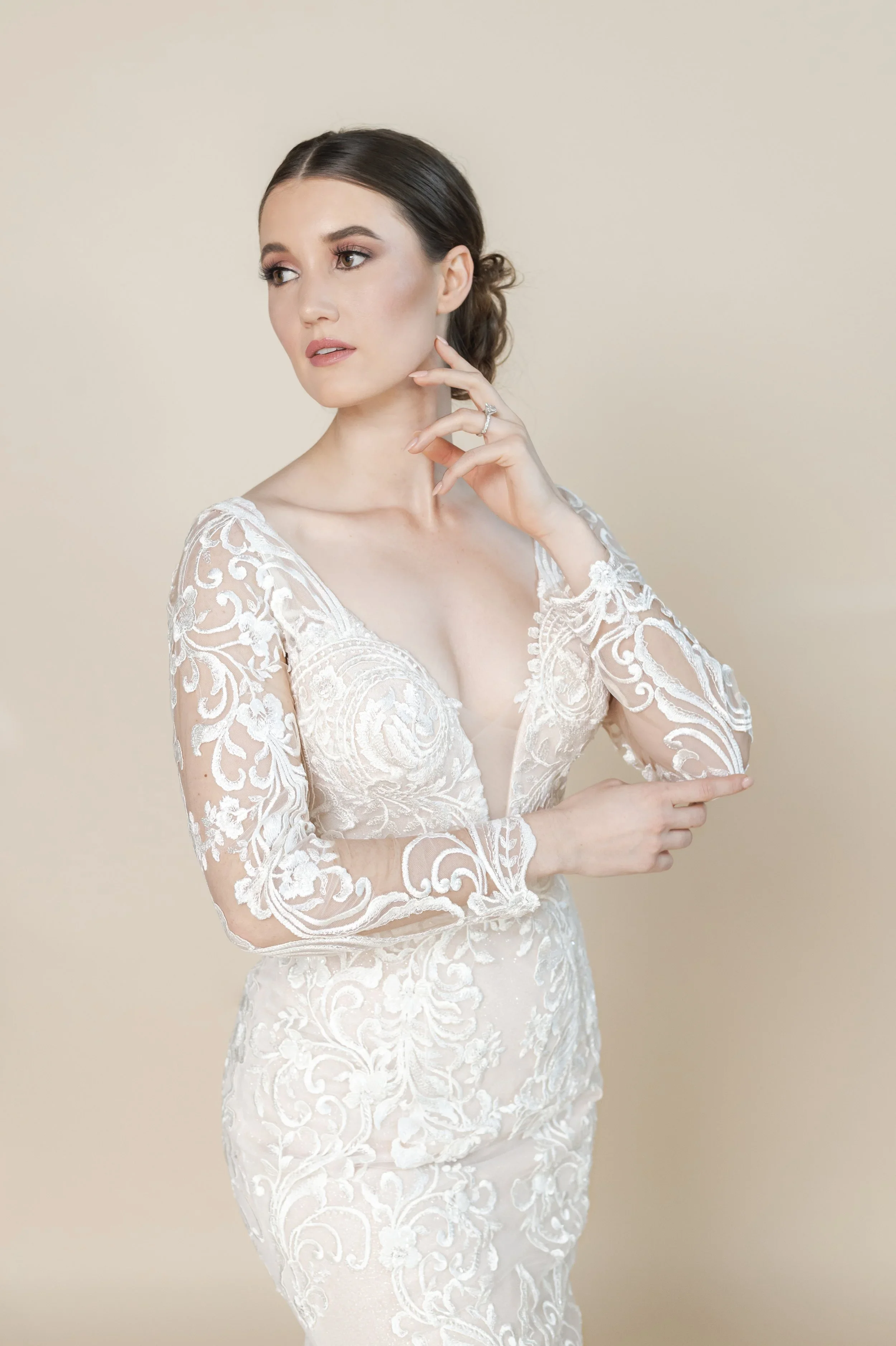 Elizabeth Lee Wendi shimmering lace mermaid wedding dress with deep plunging neckline, deep V-shaped back, and dramatic train.