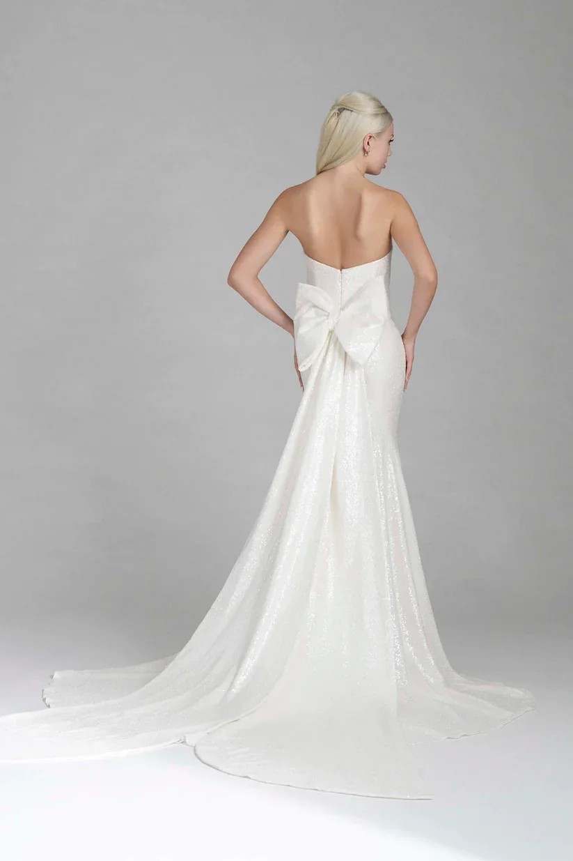 Madison James Esme sleek liquid sequin sheath wedding gown with statement-making sculptural silhouette.