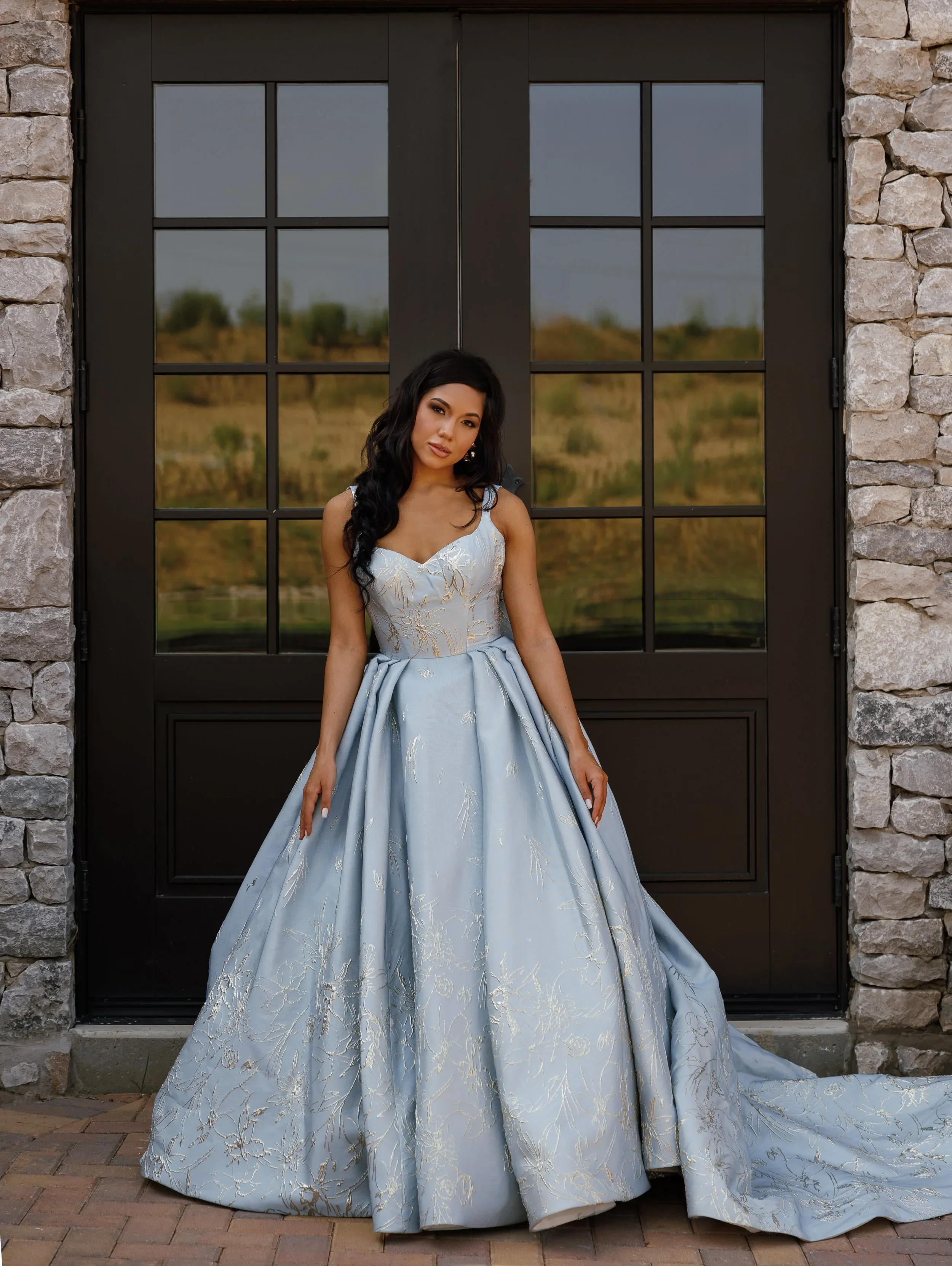 Elizabeth Lee Elizabeth blue brocade wedding dress with intricate gold embroidery, strapless sweetheart neckline, low back, and detachable bow.