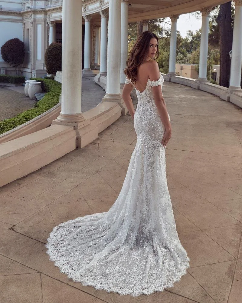 Calla Blanche Claudette 126250 lace fitted wedding dress with strapless sweetheart neckline, slim waistline, lace, and long train.