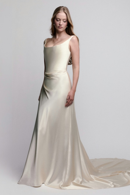 Polished charmeuse sheath wedding dress with a draped bodice, exposed corsetry, lace-up back, and straps..