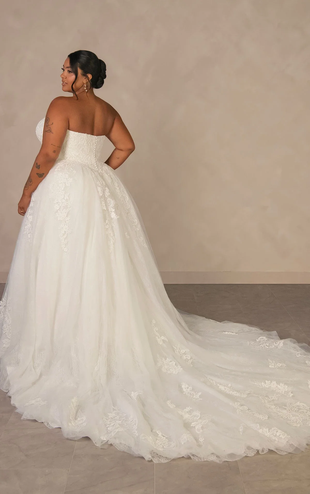 Essense of Australia D4553 enchanting strapless plus-size ballgown in lace and tulle with beaded corset bodice, detachable high-neck lace cape, and magnificent full-volume train
