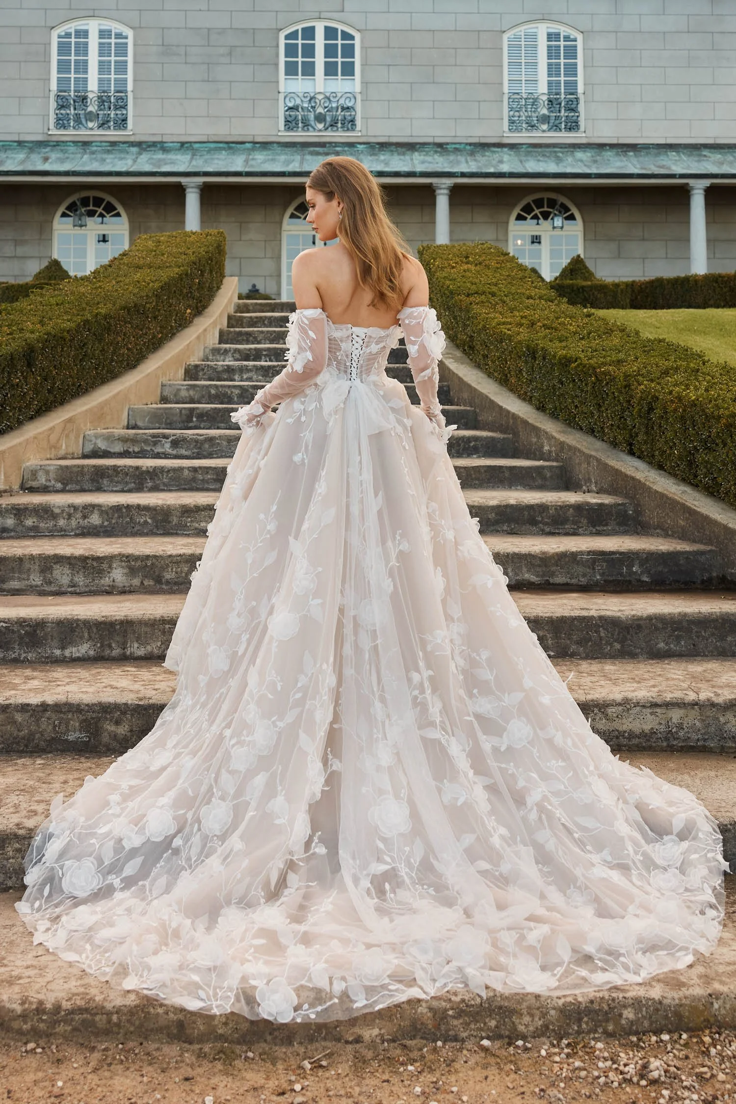 Shop Juno by Jeune at Bride To Be Couture in Sacramento, California. This romantic floral ball gown, corset bodice, off-the-shoulder sleeves, lace appliqués.