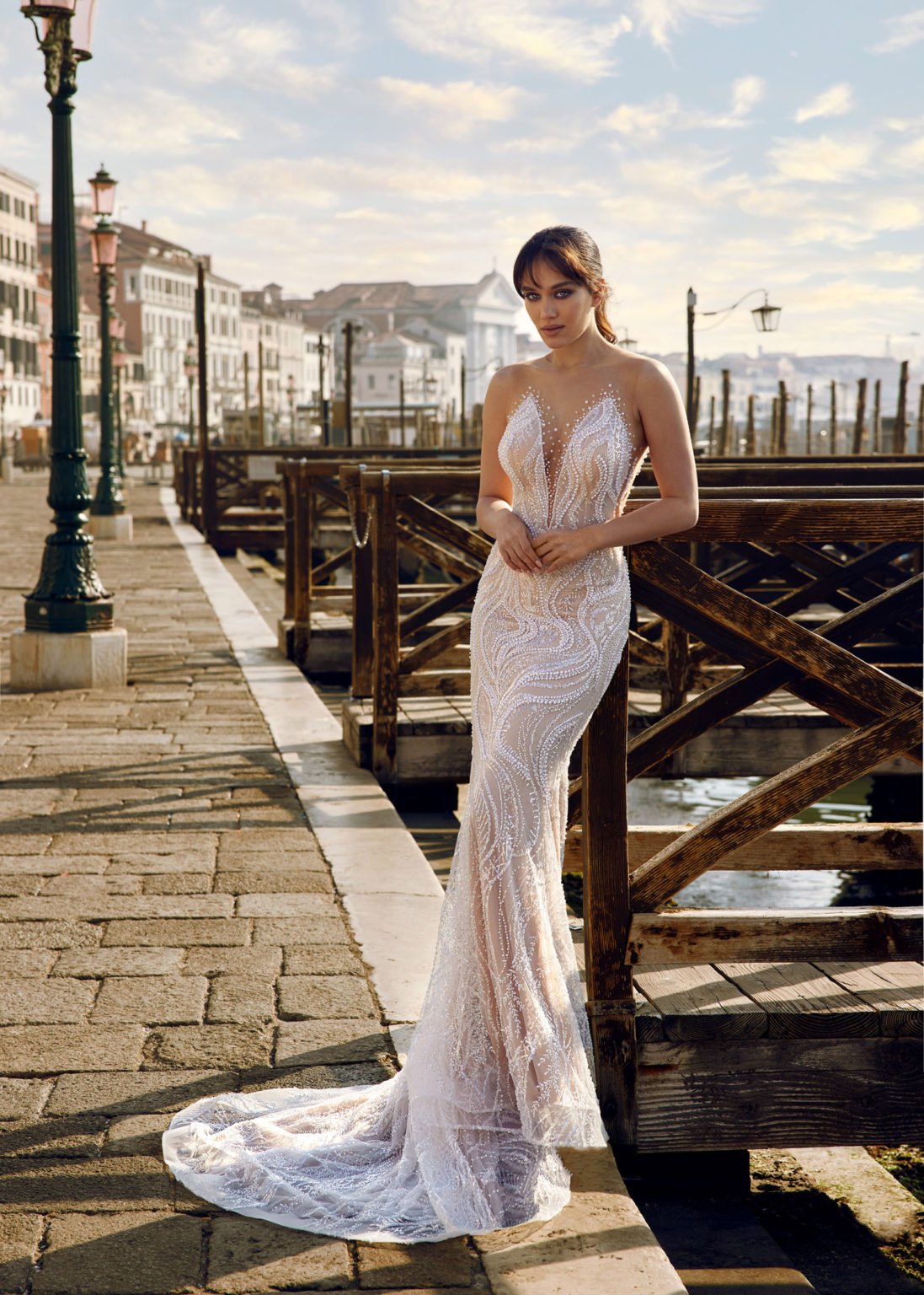 Madam Burcu Style 3051 mermaid wedding gown with plunging V-neck and all-over pearl crystal micro-beading wave pattern on nude base