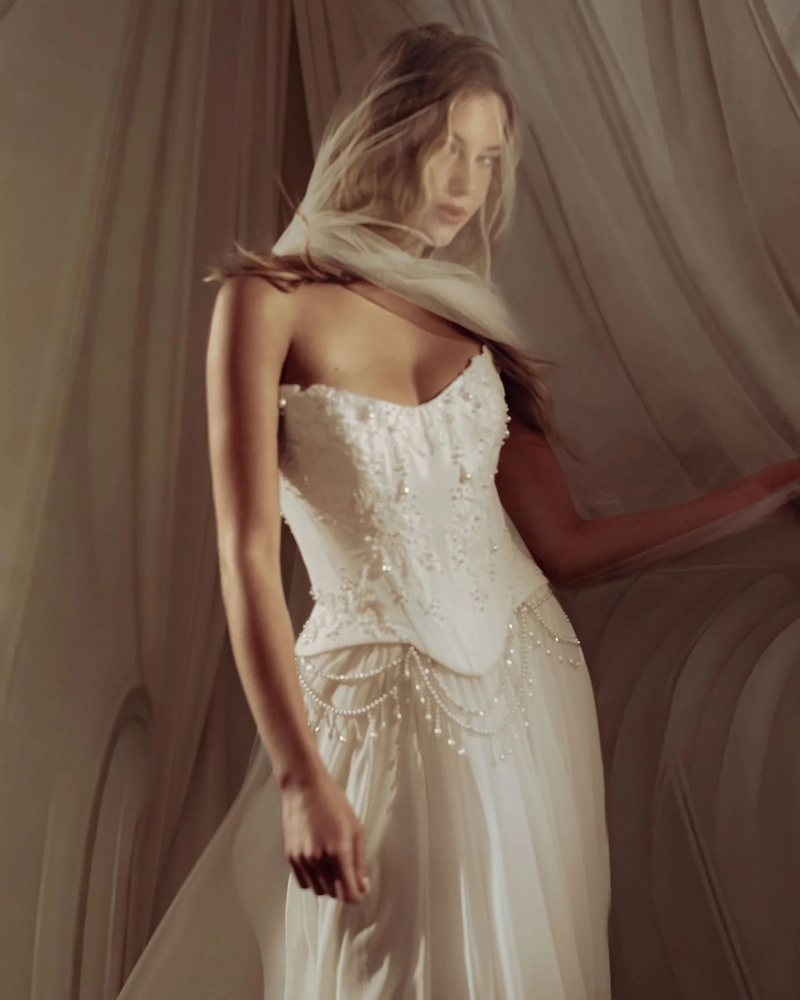 Molded taffeta corset bodice with strapless scoop neckline, draped pearl and delicate embroidery detail
