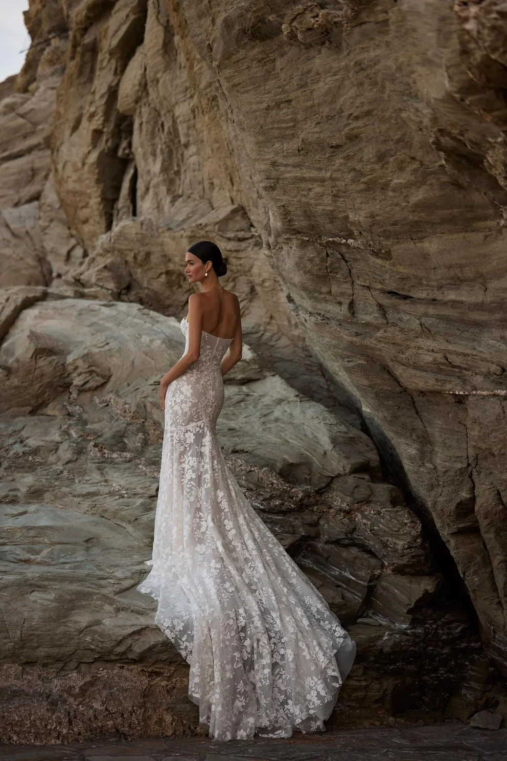 Dreamy sleeveless mermaid wedding gown fully embroidered with floral lace and sequins.