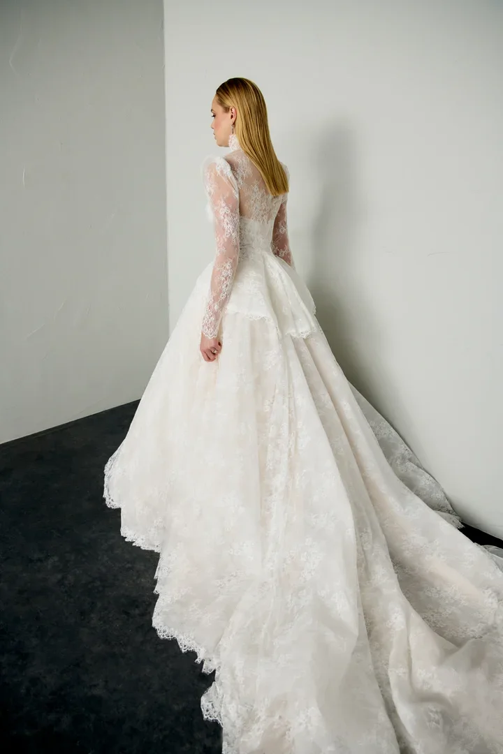 Bride wearing the Justin Alexander Signature 99392 Eris couture wedding dress with elegant structured silhouette and luxury bridal detailing