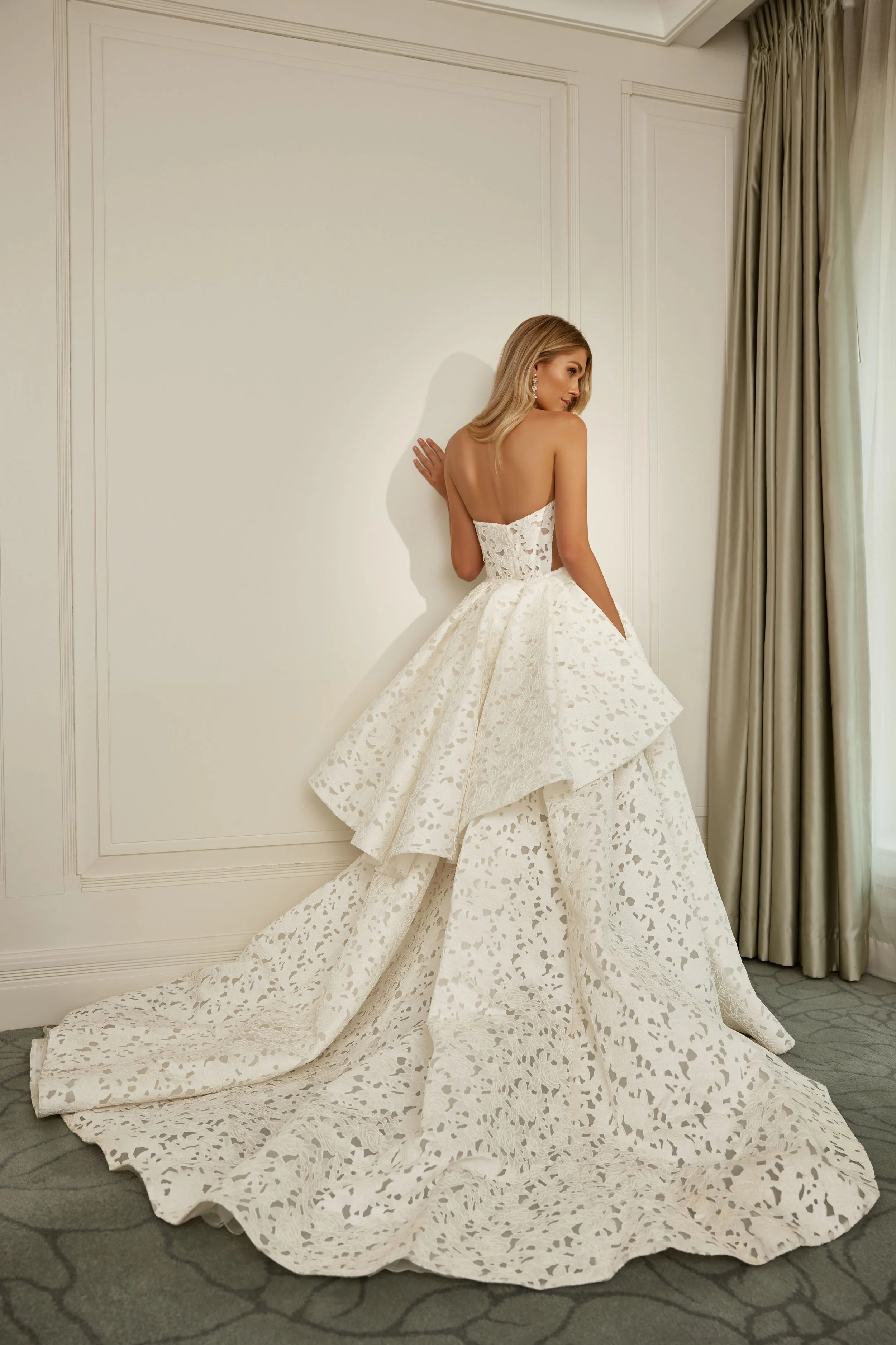 La Premiere Lucia laser-engraved satin ballgown wedding dress with strapless sweetheart neckline.