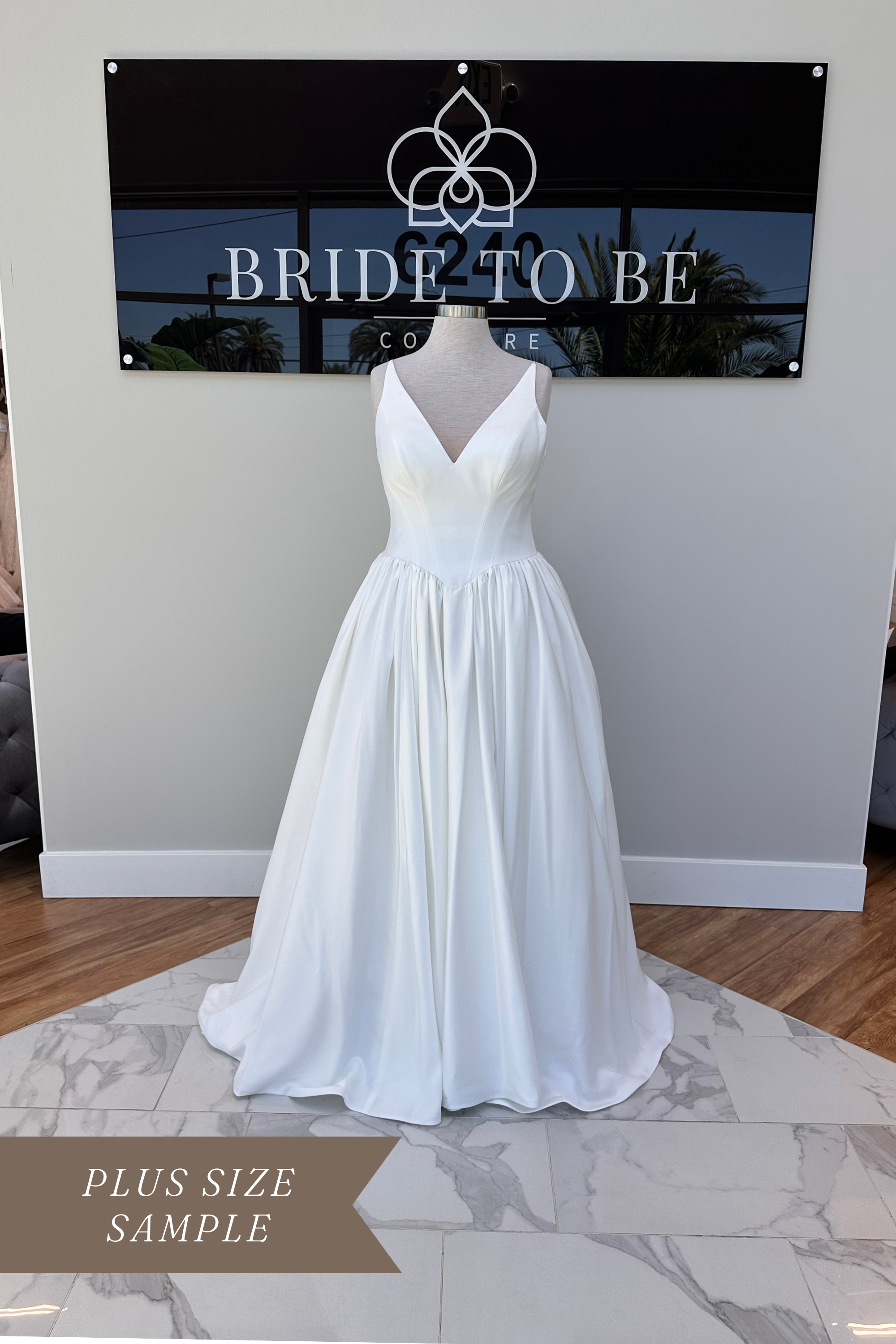Legacy Maya satin A-line wedding dress with a V neckline at Bride To Be Couture Sacramento.