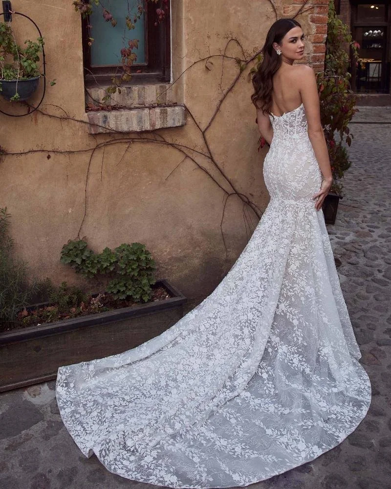 Calla Blanche Tavira 125243 strapless sweetheart mermaid wedding dress with corset bodice and beaded lace, transformable with a matching high-neck lace jacket.