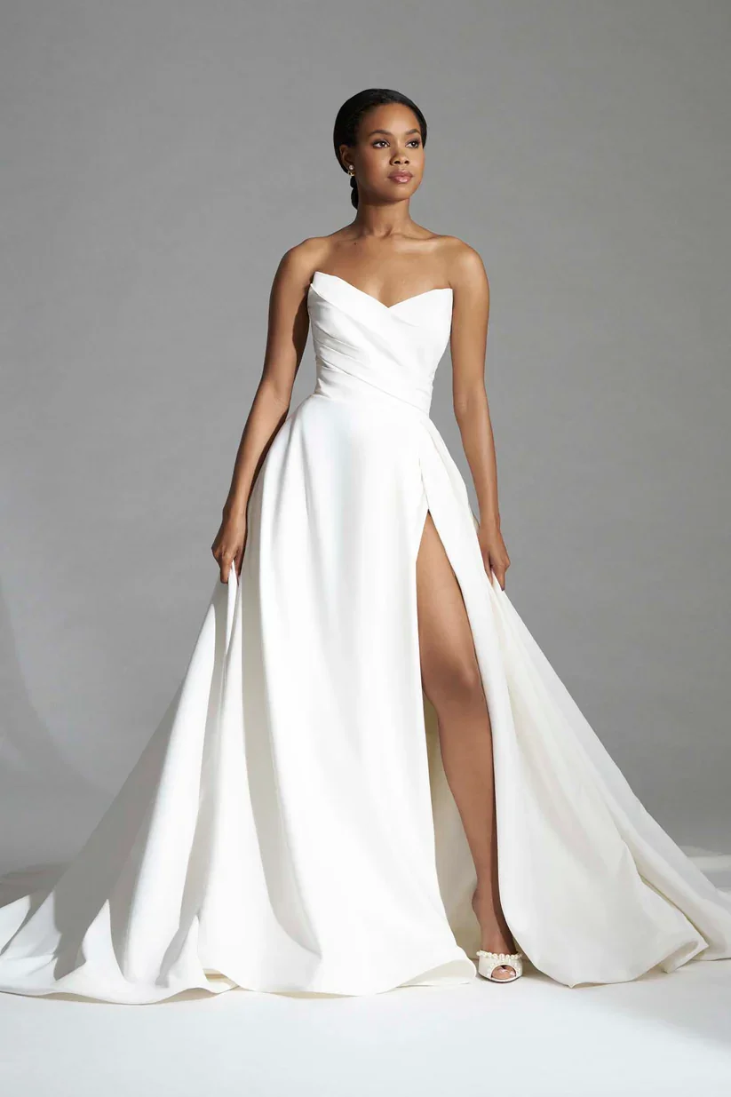 Madison James Larissa classic A-line wedding gown with statuesque strapless sweetheart bodice and dramatic front slit.