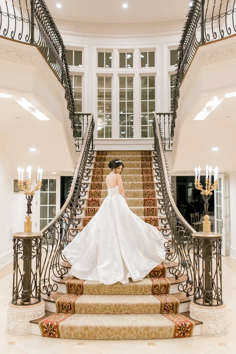 Elizabeth Lee Francesca luxurious Italian lace ballgown wedding dress with modern plunge neckline.