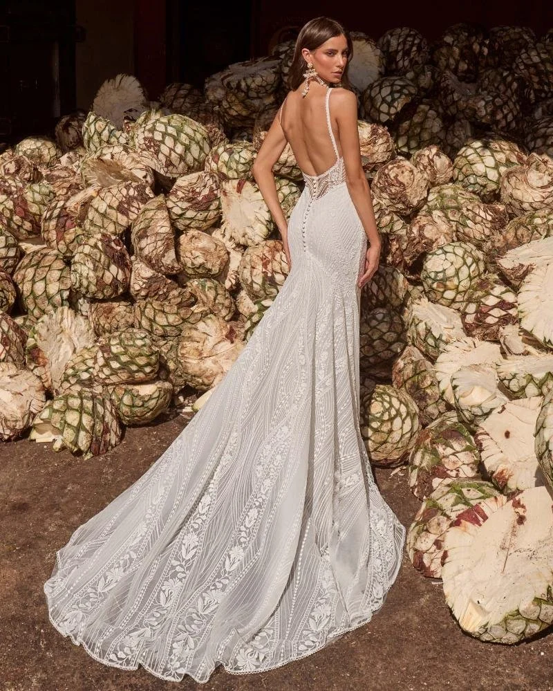 La Perle Allie boho fitted lace sheath wedding dress with semi-sweetheart square neckline, spaghetti straps, and daring backless design.