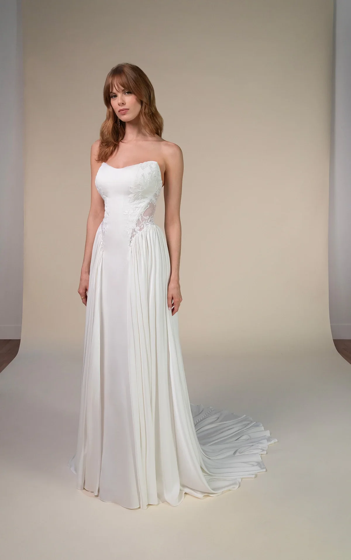 All Who Wander Romin strapless boho wedding dress in silk double crepe and lace with cat-eye neckline, side cutouts, and gathered chiffon hips, available at Bride To Be Couture in Sacramento.