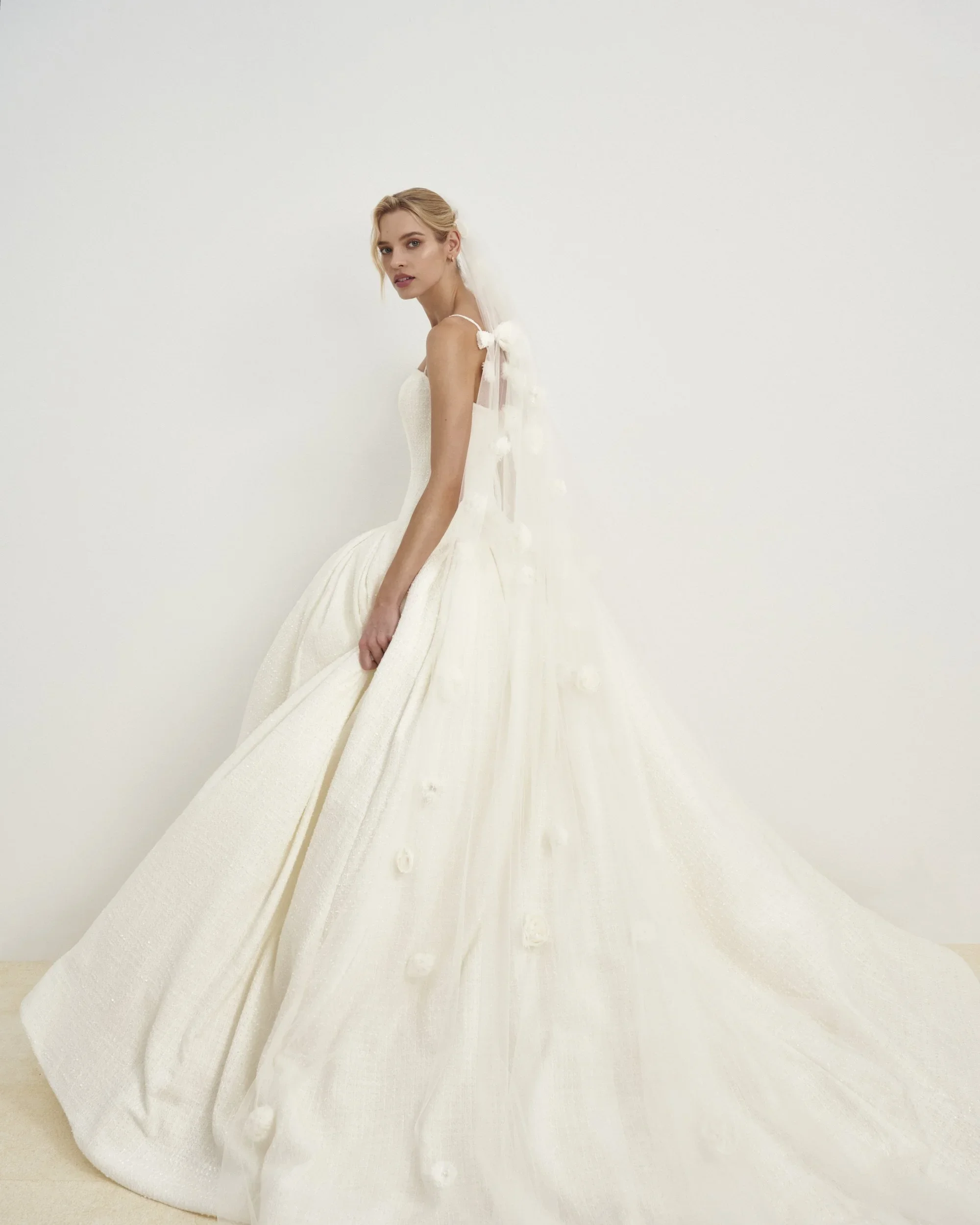 Modern Tweed Ballgown Wedding Dress With Structured Bodice And Full Textured Skirt