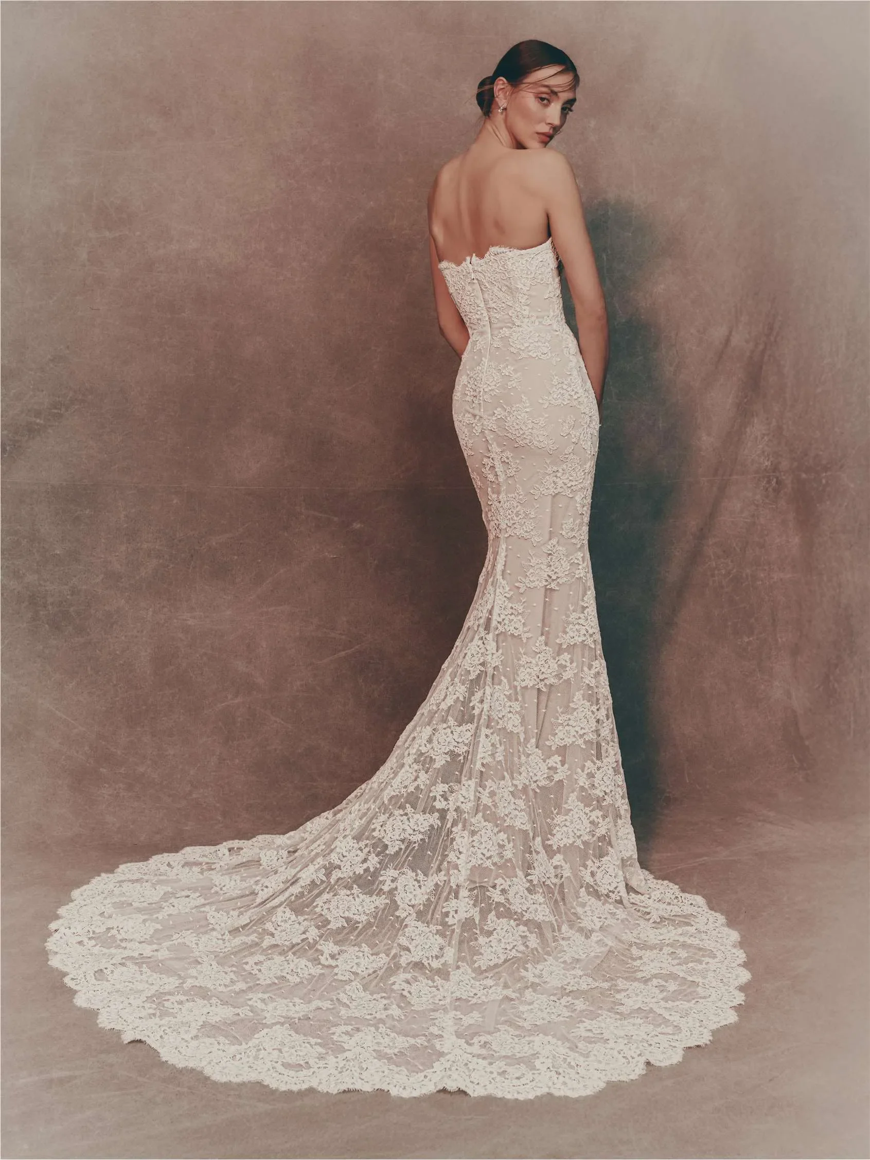 Strapless Lace Wedding Gown Featuring A Sleek Silhouette With An Optional Overskirt