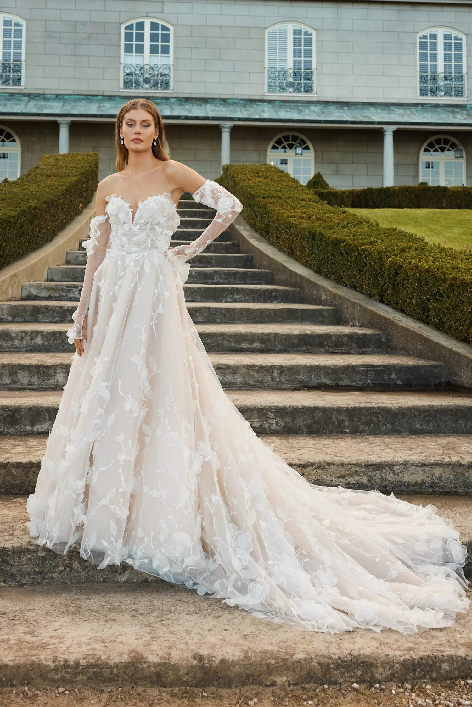 Shop Juno by Jeune at Bride To Be Couture in Sacramento, California. This romantic floral ball gown, corset bodice, off-the-shoulder sleeves, lace appliqués.
